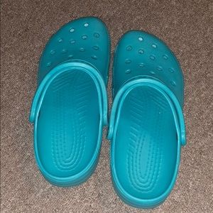 Blue crocs, size 7 in men’s and a 9 in woman’s.